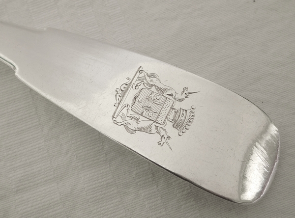 Empire sterling silver serving spoon, coat of arms engraved, early 19th century