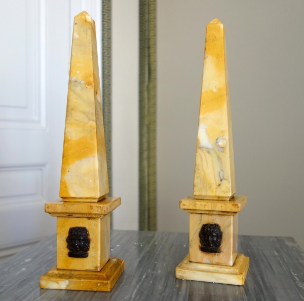 Pair of Sienna marble obelisks, patinated bronze masks - Empire style