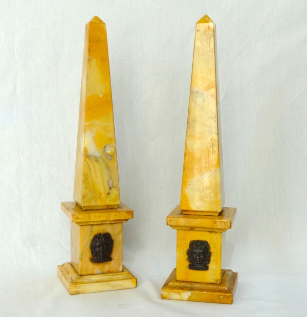Pair of Sienna marble obelisks, patinated bronze masks - Empire style