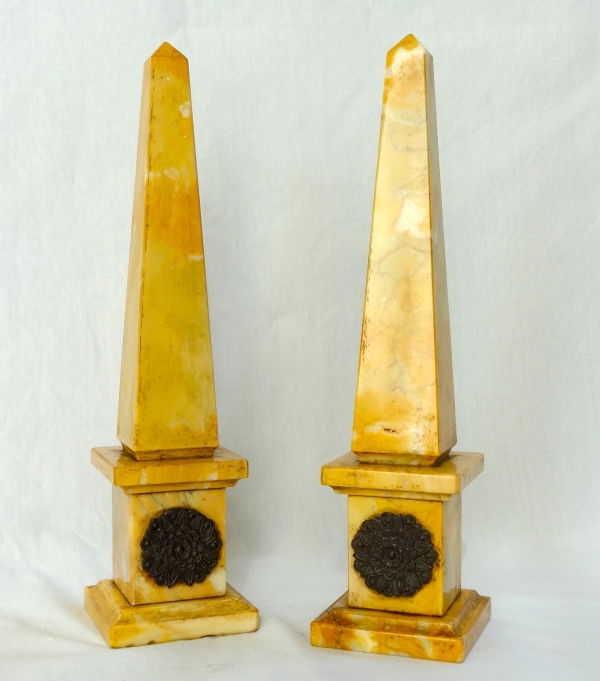 Pair of Sienna marble obelisks, patinated bronze masks - Empire style