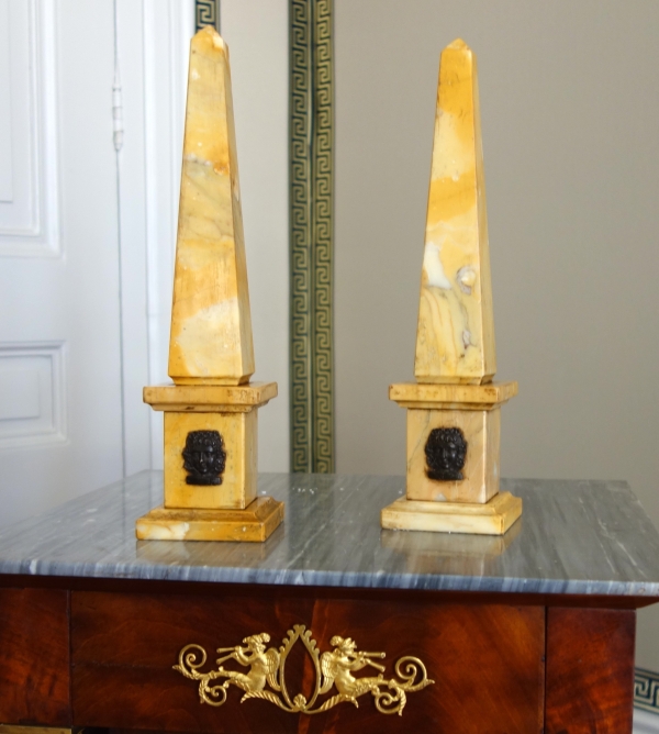 Pair of Sienna marble obelisks, patinated bronze masks - Empire style
