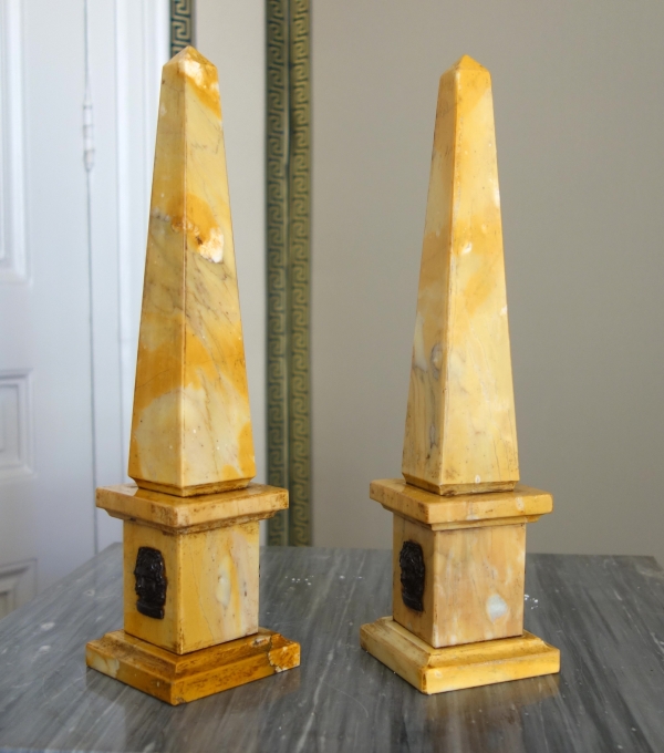 Pair of Sienna marble obelisks, patinated bronze masks - Empire style