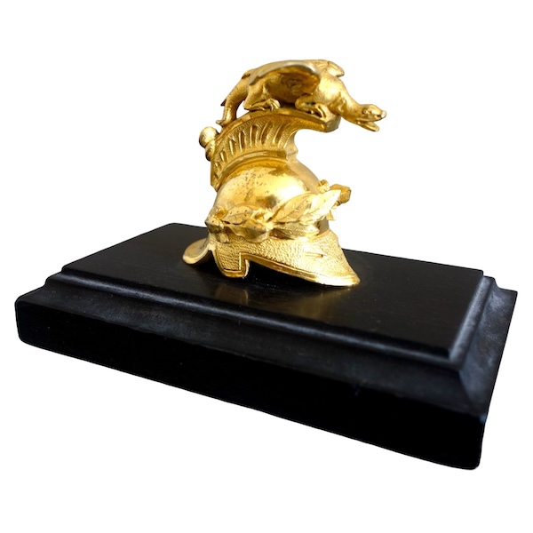 Empire ebony and ormolu paper weight, early 19th century