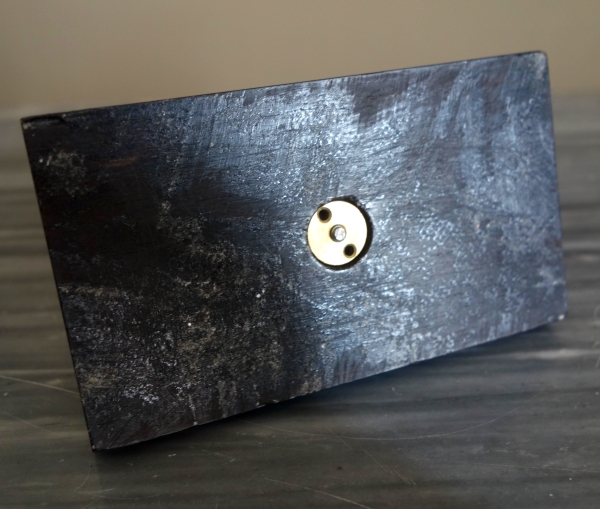 Empire ebony and ormolu paper weight, early 19th century