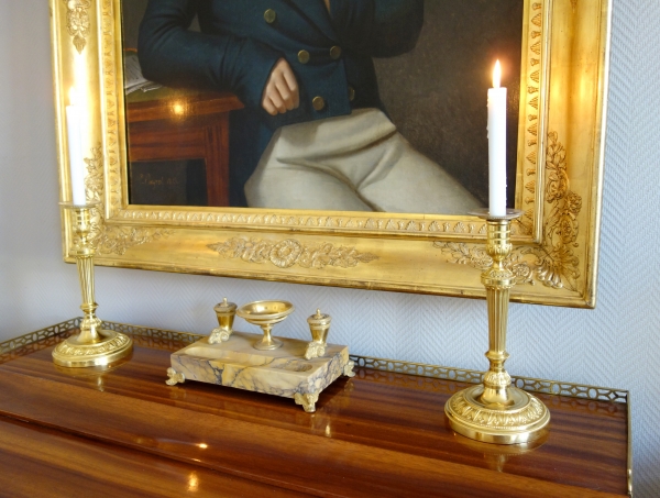 Pair of Louis XVI ormolu candlesticks, model of Fontainebleau Palace