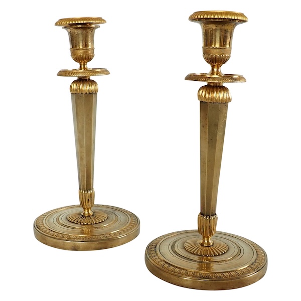 Ravrio : Pair of Empire ormolu candlesticks, early 19th century