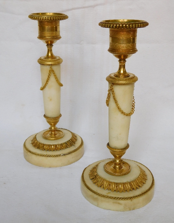 Pair of marble and ormolu candlesticks, end of Louis XVI production