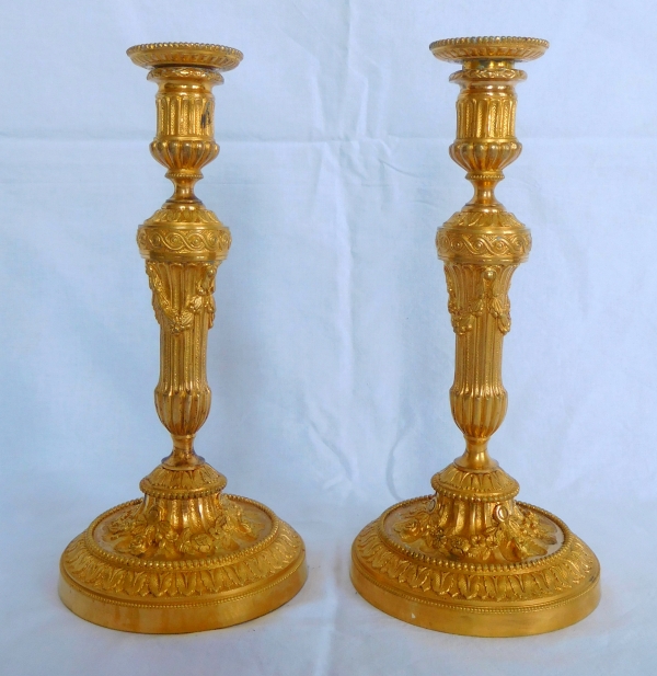 Pair of Louis XVI style ormolu candlesticks - 19th century