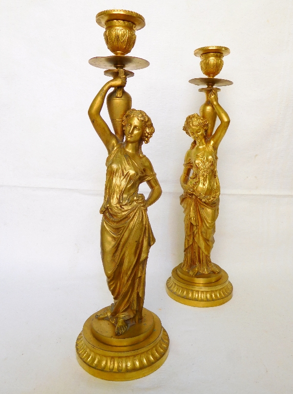 Tall pair of ormolu candlesticks picturing Bacchantes, Napoleon III production, mid 19th century