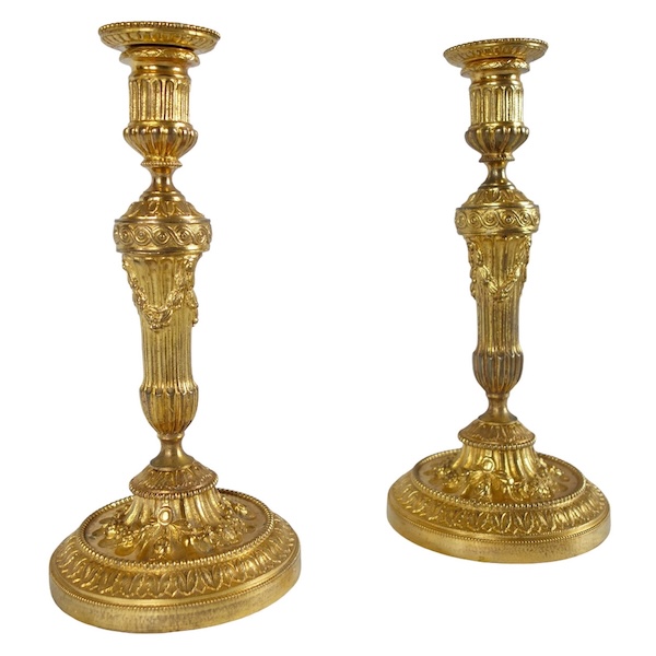 Pair of Louis XVI style ormolu candlesticks - 19th century