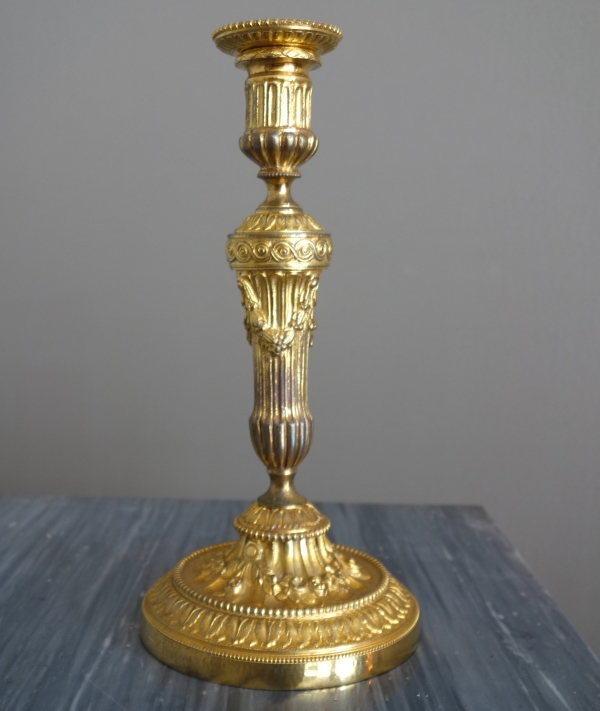 Pair of Louis XVI style ormolu candlesticks - 19th century