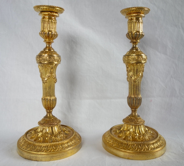 Pair of Louis XVI style ormolu candlesticks - 19th century