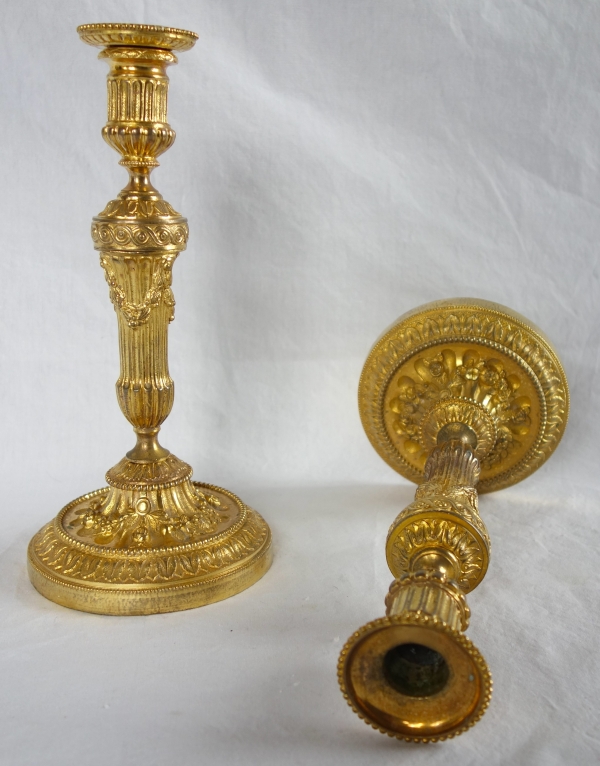 Pair of Louis XVI style ormolu candlesticks - 19th century