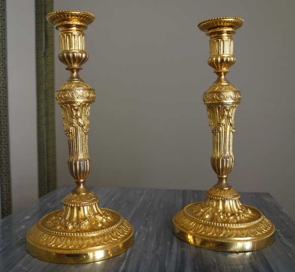 Pair of Louis XVI style ormolu candlesticks - 19th century