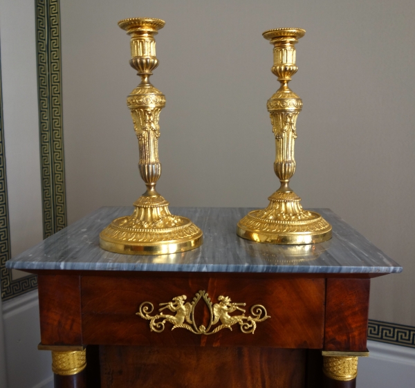 Pair of Louis XVI style ormolu candlesticks - 19th century