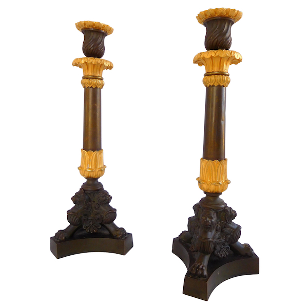 Pair of patinated bronze and ormolu tripod candlesticks, early 19th century
