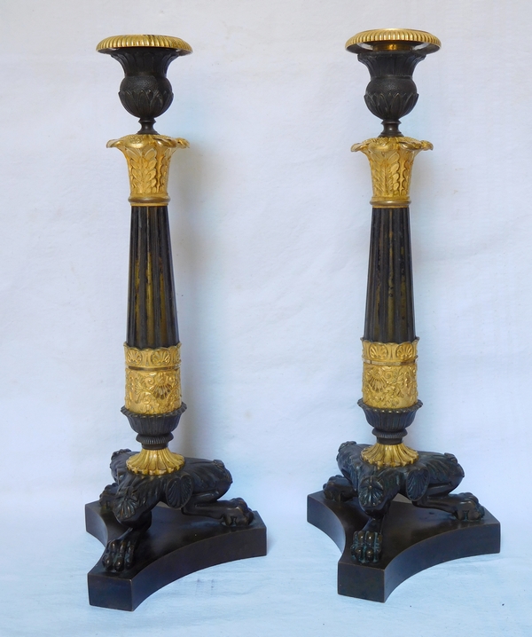 Pair of Empire patinated bronze and ormolu candlesticks, early 19th century circa 1820