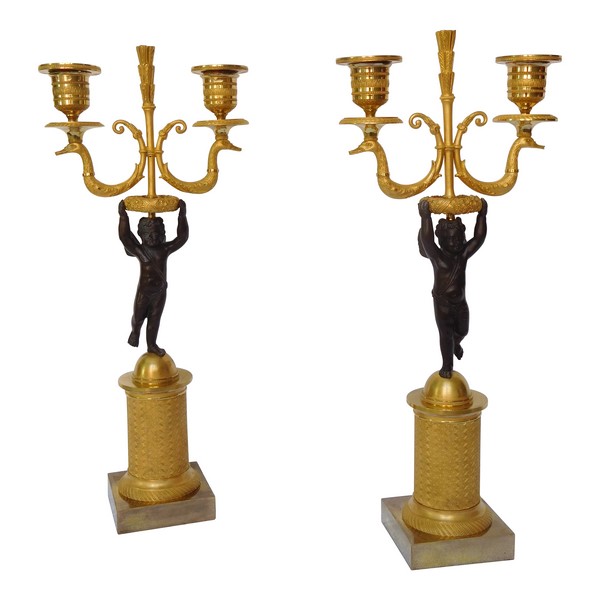 Paire de candélabres en bronze patiné et doré d'époque Empire / Restauration