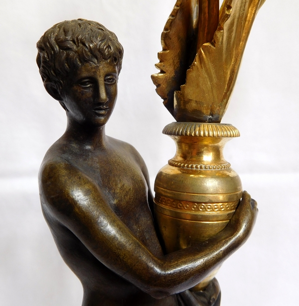 Paire de candélabres aux Romains, bronze patiné et doré, époque Empire