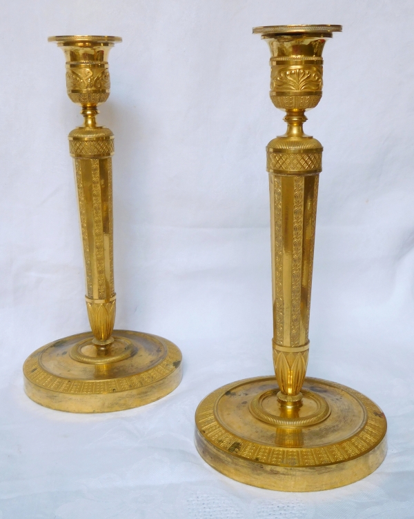 Pair of Empire ormolu candlesticks, early 19th century - 27cm