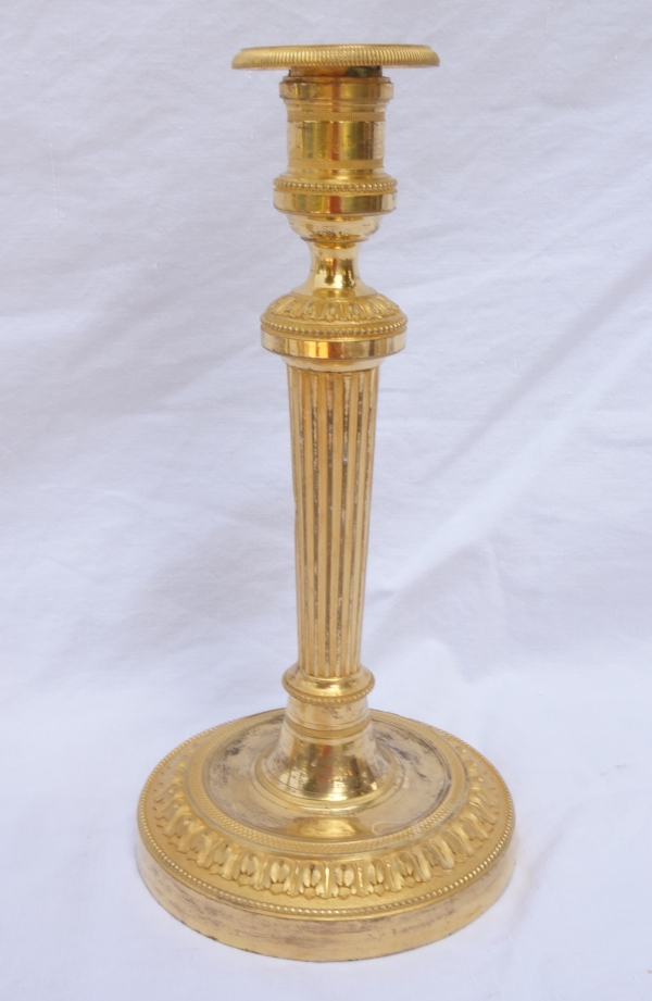 Paire de flambeaux / bougeoirs en bronze doré d'époque Louis XVI