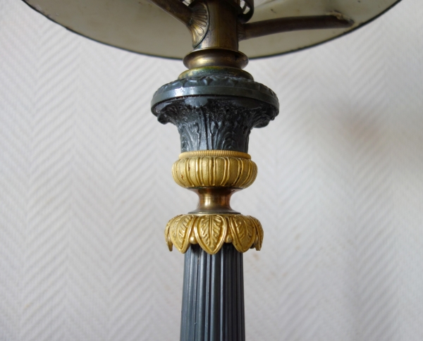 Paire de lampes Carcel en bronze patiné et doré, époque Restauration