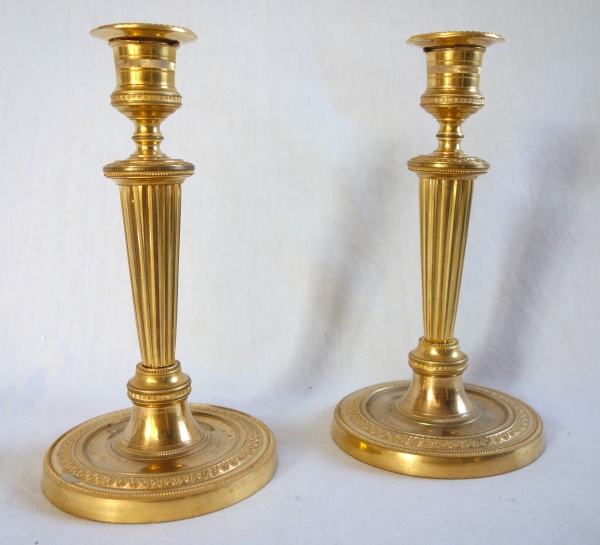 Pair of Louis XVI style ormolu candlesticks, Empire period circa 1800 - 19cm