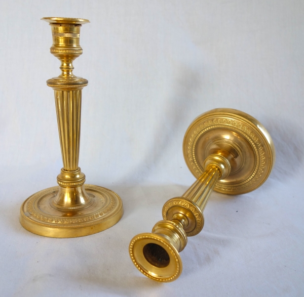 Pair of Louis XVI style ormolu candlesticks, Empire period circa 1800 - 19cm