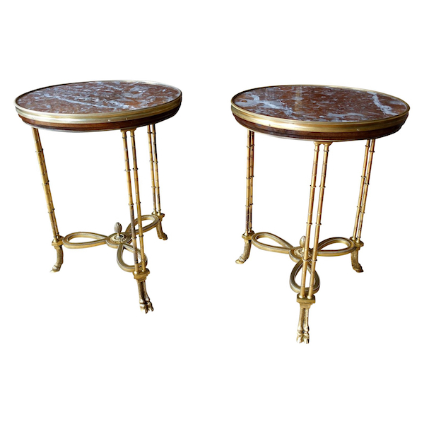 Pair of bronze, marble and mahogany pedestal tables after Weisweiler, Louis XVI style