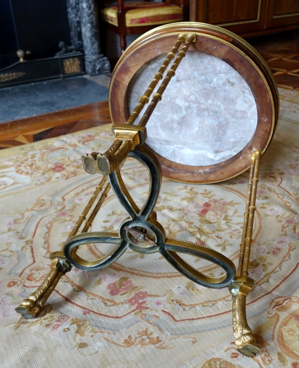 Pair of bronze, marble and mahogany pedestal tables after Weisweiler, Louis XVI style