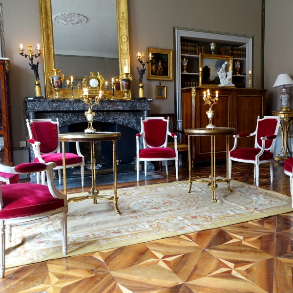 Pair of bronze, marble and mahogany pedestal tables after Weisweiler, Louis XVI style