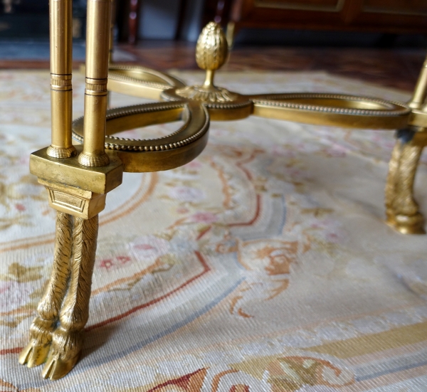 Pair of bronze, marble and mahogany pedestal tables after Weisweiler, Louis XVI style