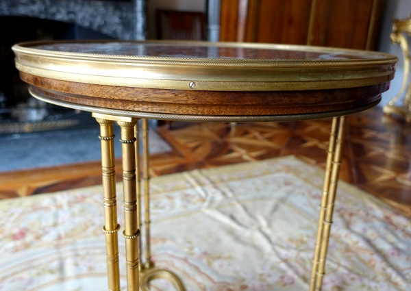 Pair of bronze, marble and mahogany pedestal tables after Weisweiler, Louis XVI style