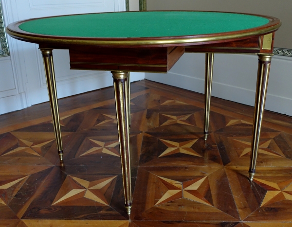 Mahogany half moon shaped game table, Louis XVI period, late 18th century