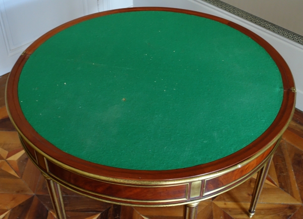 Mahogany half moon shaped game table, Louis XVI period, late 18th century