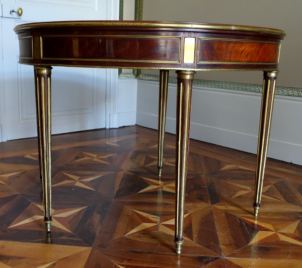 Mahogany half moon shaped game table, Louis XVI period, late 18th century