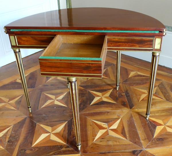 Mahogany half moon shaped game table, Louis XVI period, late 18th century