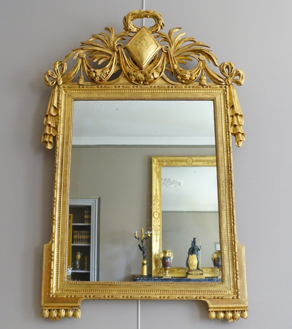 Large gold leaf gilt wood Louis XVI mirror, 18th century