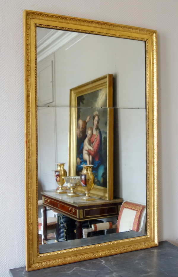 Miroir d'entre deux ou de cheminée d'époque Empire en bois doré, glace au mercure - 129cm x 80cm