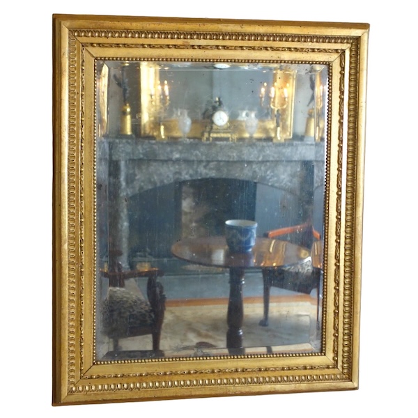 Miroir de boiserie à suspendre en bois doré à la feuille d'or, glace mercure - époque Louis XVI