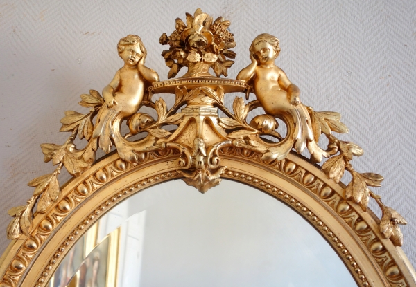 Miroir ovale de style Louis XVI en bois doré, époque Napoléon III - 71cm x 111cm