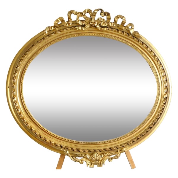 Wide Louis XVI style ovale mirror, gold leaf gilt wood, Napoleon III period, 19th century - 96cm x 91cm