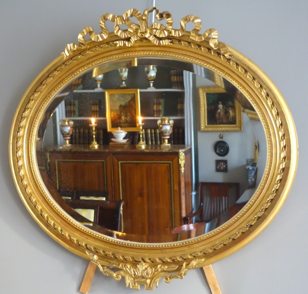 Wide Louis XVI style ovale mirror, gold leaf gilt wood, Napoleon III period, 19th century - 96cm x 91cm