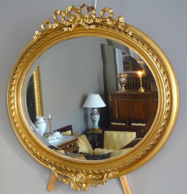 Wide Louis XVI style ovale mirror, gold leaf gilt wood, Napoleon III period, 19th century - 96cm x 91cm
