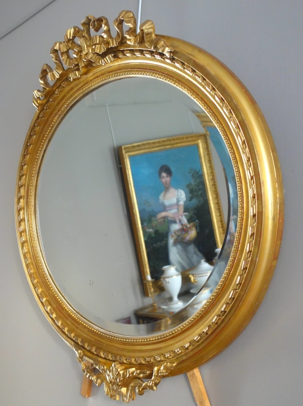 Wide Louis XVI style ovale mirror, gold leaf gilt wood, Napoleon III period, 19th century - 96cm x 91cm