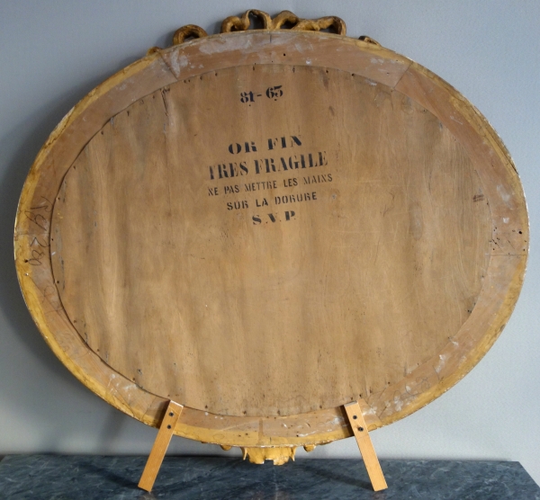 Wide Louis XVI style ovale mirror, gold leaf gilt wood, Napoleon III period, 19th century - 96cm x 91cm