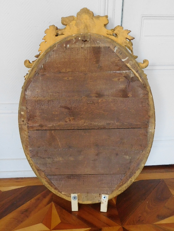 Louis XVI style gilt wood oval mirror, Napoleon III period - 19th century - 62cm X 95cm