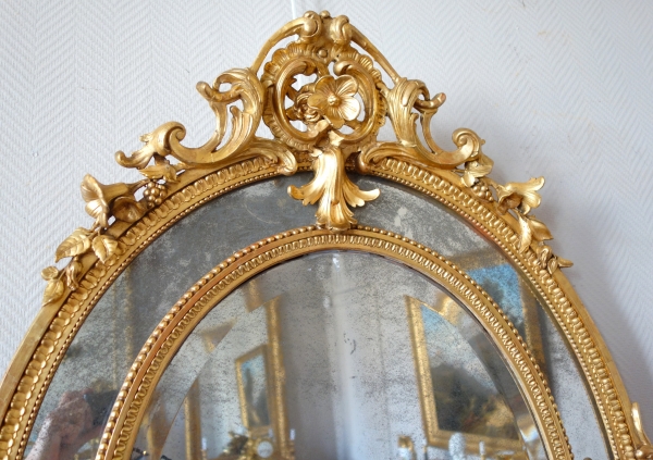 Miroir ovale à parecloses en bois doré, glaces au mercure, époque Napoleon III