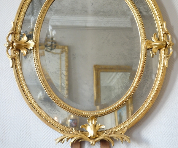 Gold leaf gilt wood oval mirror, mercury mirror, Napoleon III production
