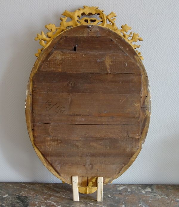 Grand miroir ovale de style Louis XVI en bois doré à la feuille d'or époque Napoléon III - 95,5cm x 60cm